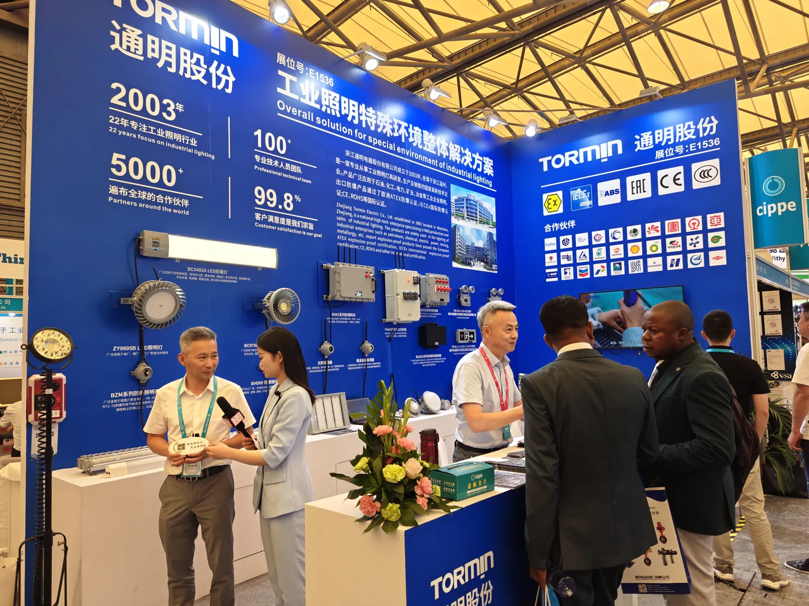 Visitors and team members at the exhibition counter.